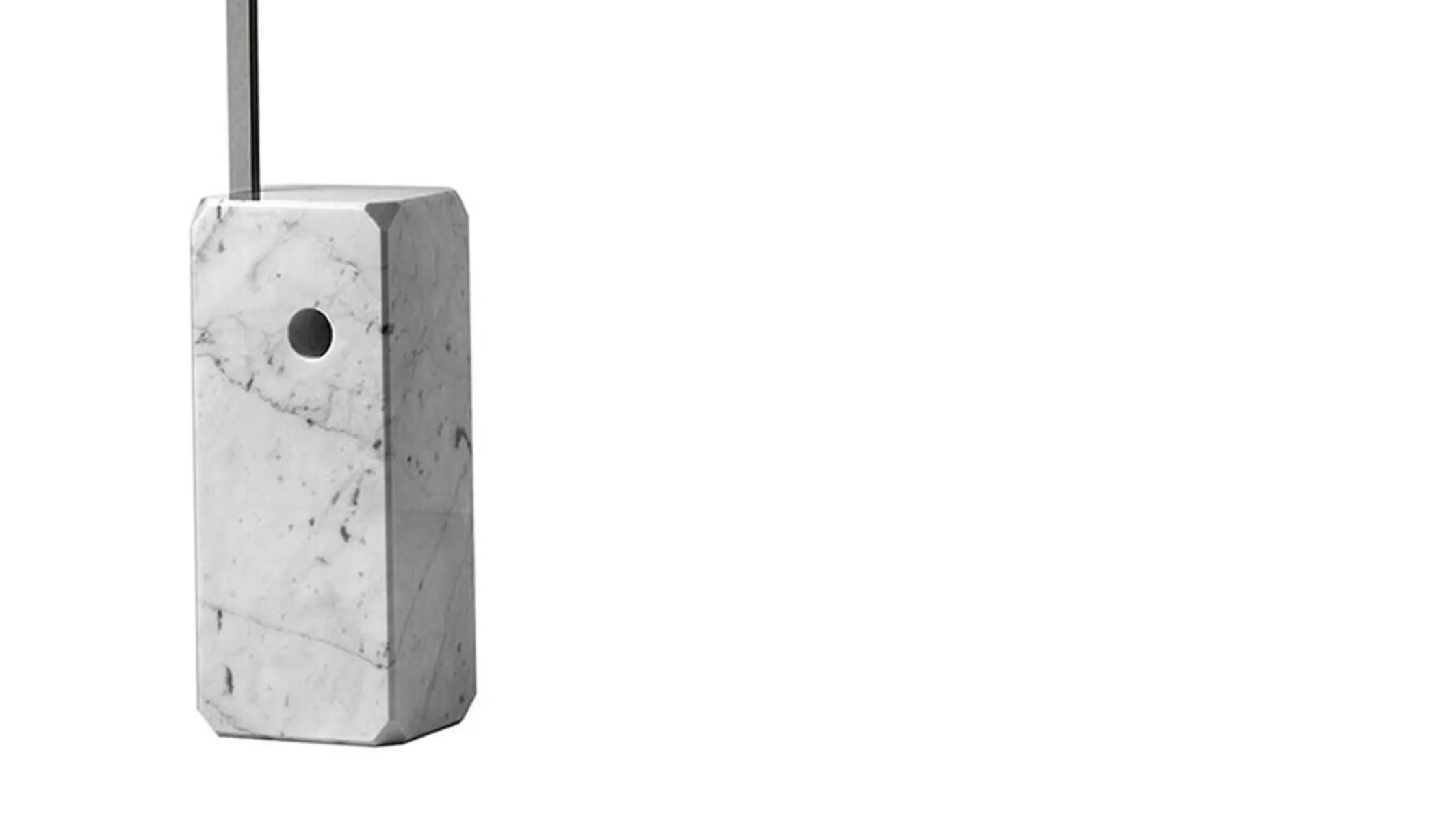 Close detail of the marble base, showing the bored hole that doubles as a carrying handle.