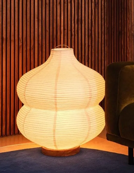 The Carta rice paper floor lamp — a large white globe on a slender stem