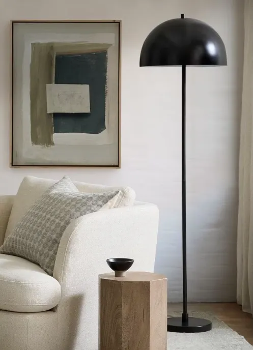 The Niall floor lamp — a mushroom-shaped shade on a slender stem