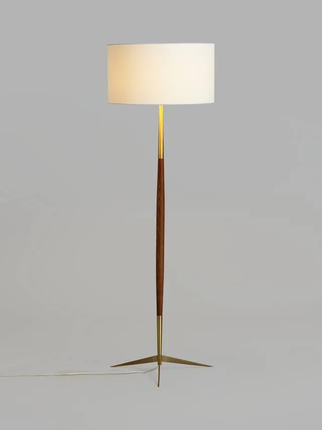 The Spindle wooden floor lamp — a turned wooden stem in brass and warm brown