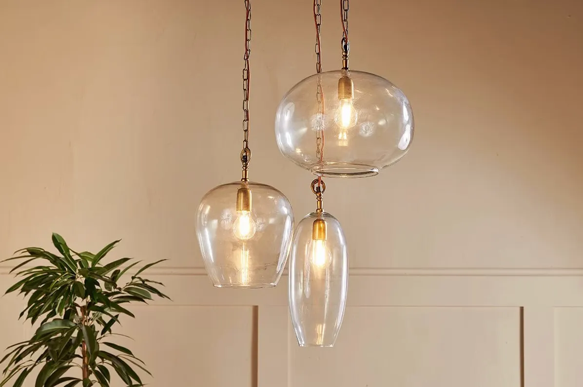 A cluster of hand-blown recycled-glass pendants