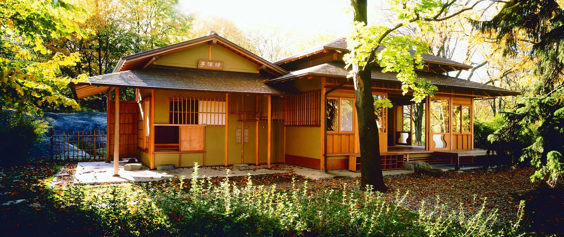The exterior of a Japanese teahouse, showing the the nijiriguchi, the small door used to enter the building.